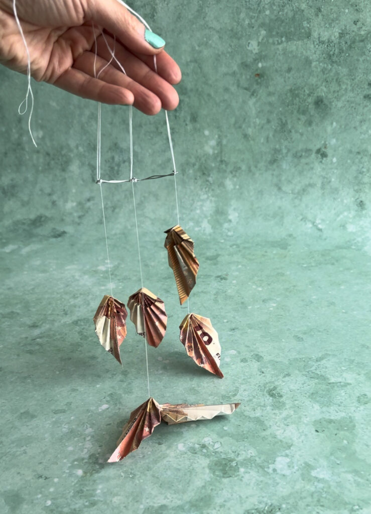 Geld falten Palmblätter