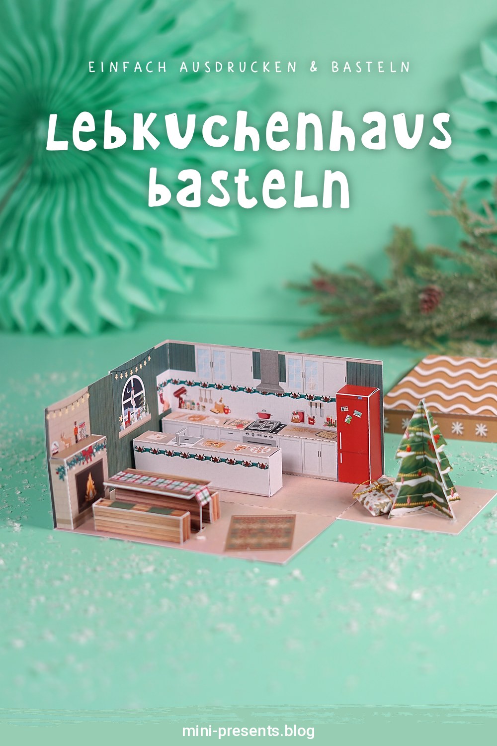 Lebkuchenhaus basteln: aufgeklappte Weihnachtsbäckerei Explosionsbox auf mintfarbenem Hintergrund